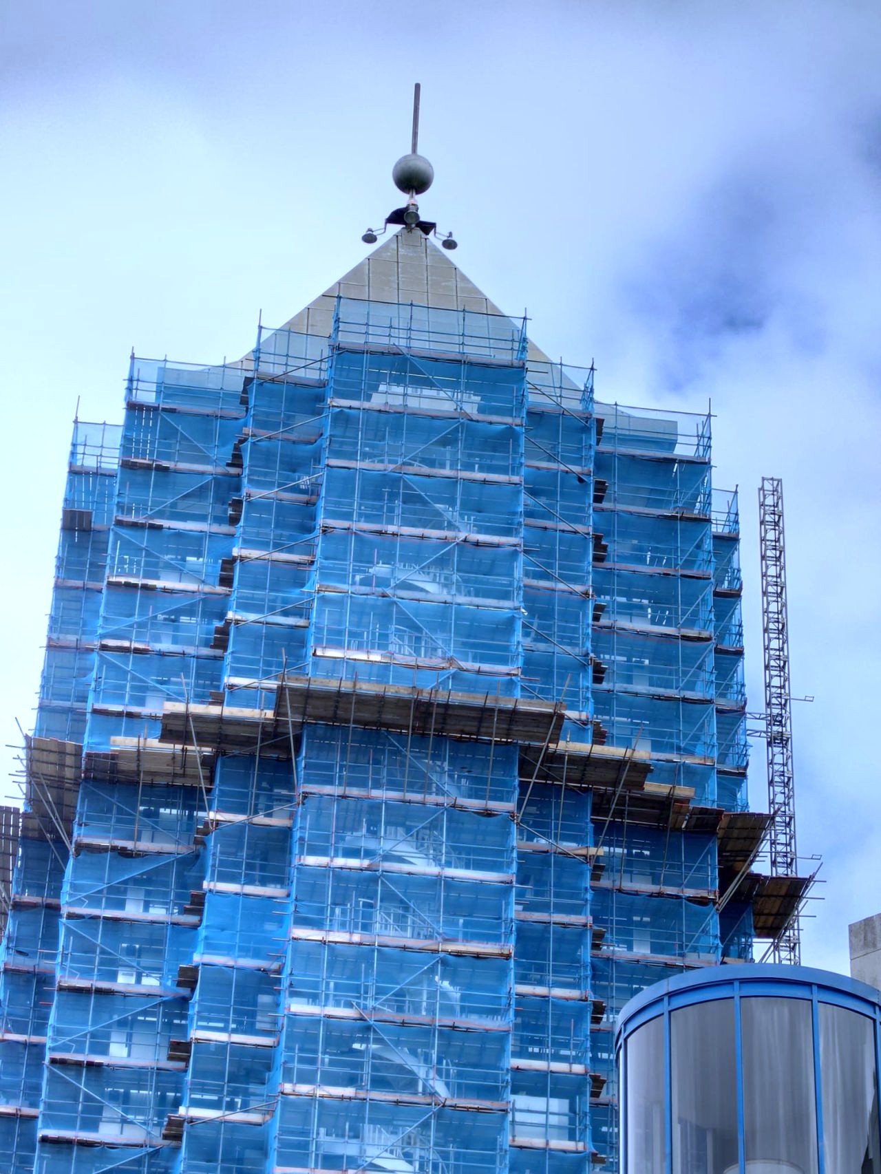 An old building covered in scaffolding due to repairs