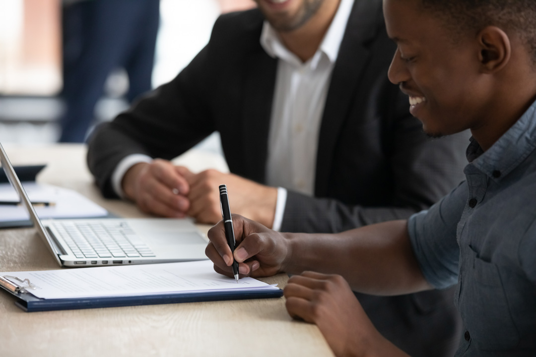 Individuals reviewing a contract