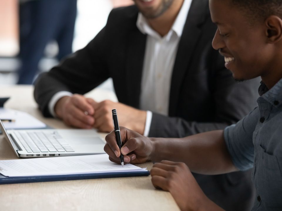 Individuals reviewing a contract